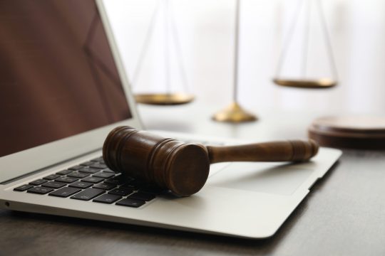 Laptop,,Gavel,And,Scales,On,Table,,Closeup.,Cyber,Crime