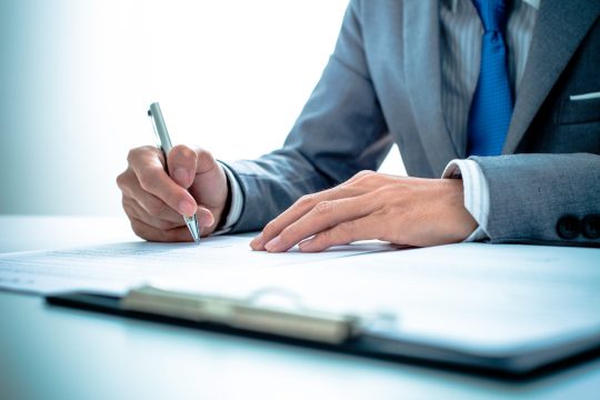 Business,Man,Signing,A,Contract
